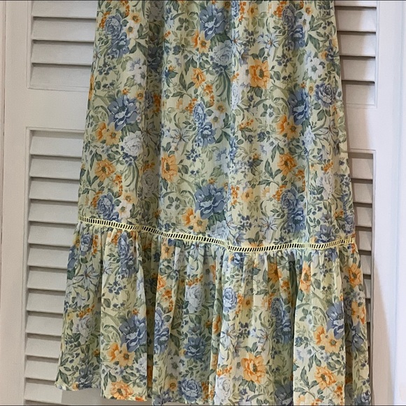 Round neck, sleeveless with ruffle trim at cuffs,pullover style, smocked bodice - Picture 3 of 4